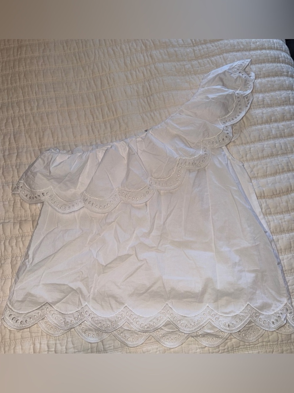 One shoulder white top